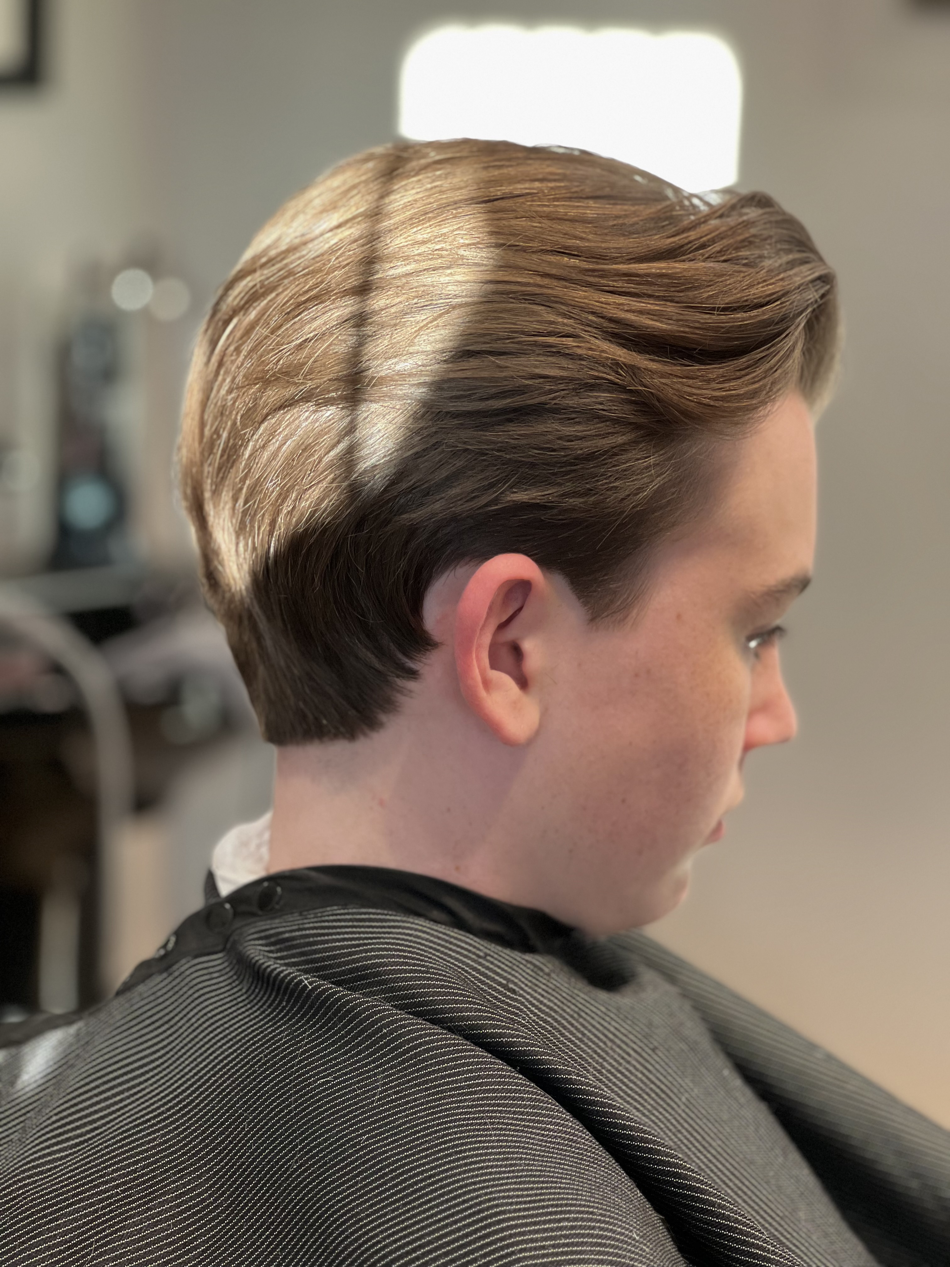 90s-inspired flow haircut finished at Maxx's Shaving Room in Stuart Florida